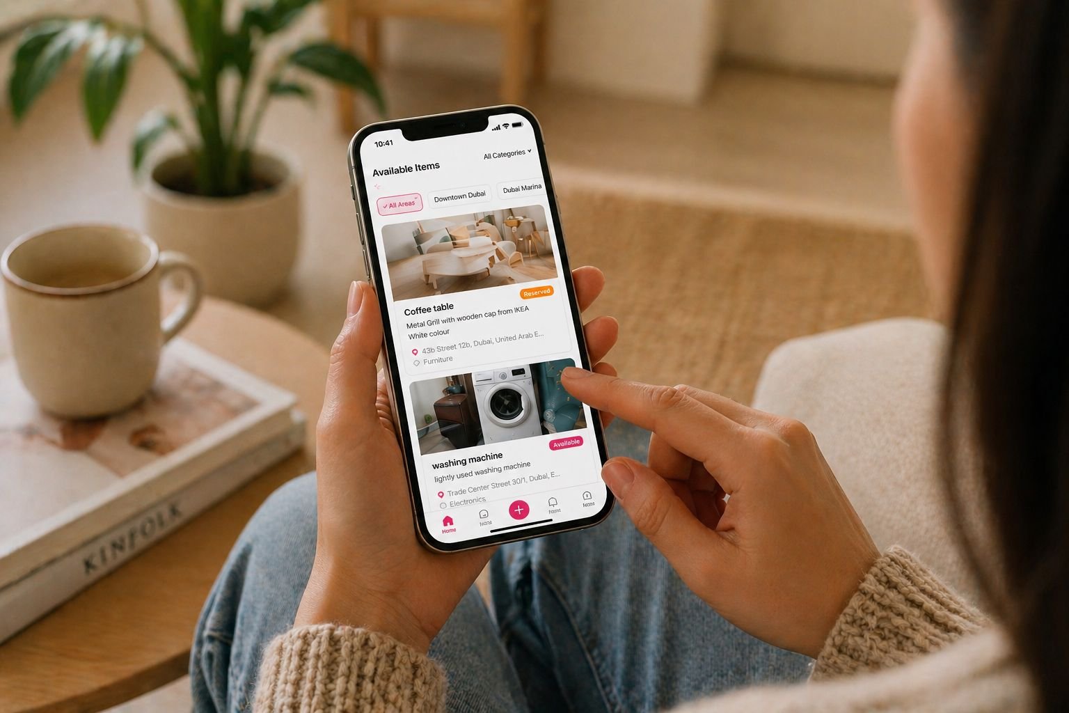 Person browsing available household items in the Hiiba app